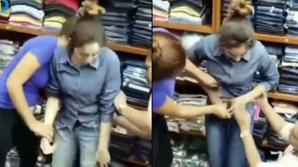 woman caught by clothes shop workers 